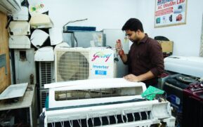 Technician repairing an air conditioner unit in New Delhi workshop. - Photo by Multitech Institute on Pexels